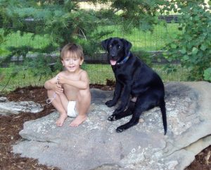 Black Lab puppy and his best friend